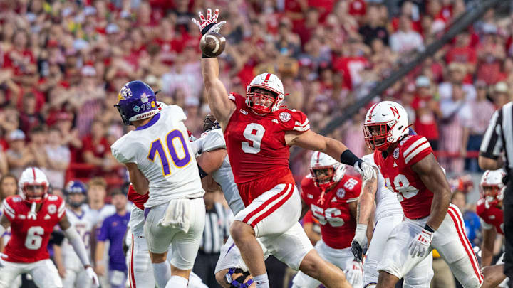 Nebraska defensive lineman Ty Robinson bats down a pass from Northern Iowa quarterback Aidan Dunne.