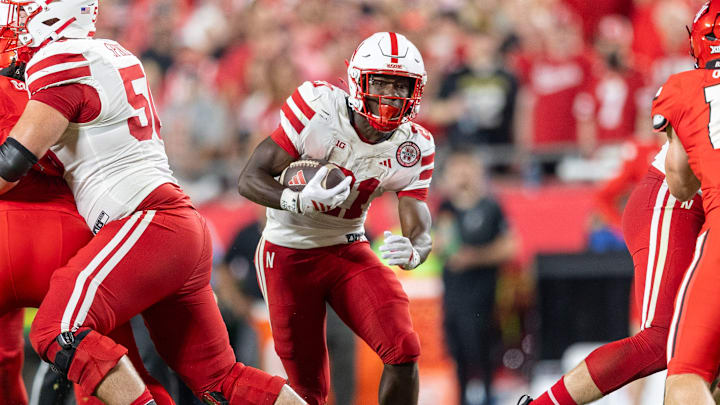 Nebraska running back Emmett Johnson rushes for a 6-yard gain at Arrowhead Stadium against Cincinnati.