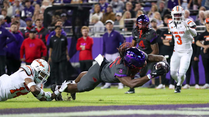 Savion Williams reaches for the goal line to extend the TCU lead in the 2nd half. Savion Williams reaches for the goal line to extend the TCU lead in the 2nd half.