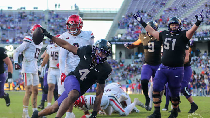 TCU running back Cam Cook scores a touchdown in the win over Arizona. TCU running back Cam Cook scores a touchdown in the win over Arizona.