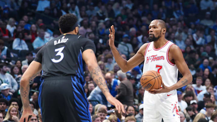Jan 3, 2026; Dallas, Texas, USA;  Houston Rockets forward Kevin Durant (7) controls the ball as Dallas Mavericks forward Anthony Davis (3) defends during the first quarter at American Airlines Center. Mandatory Credit: Kevin Jairaj-Imagn Images