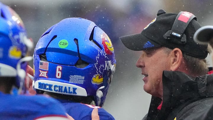 Oct 25, 2025; Lawrence, Kansas, USA; Kansas Jayhawks head coach Lance Leipold talks with quarterback Jalon Daniels (6) after he scores a touchdown against the Kansas State Wildcats during the first half of the game at David Booth Kansas Memorial Stadium. Mandatory Credit: Denny Medley-Imagn Images Oct 25, 2025; Lawrence, Kansas, USA; Kansas Jayhawks head coach Lance Leipold talks with quarterback Jalon Daniels (6) after he scores a touchdown against the Kansas State Wildcats during the first half of the game at David Booth Kansas Memorial Stadium. Mandatory Credit: Denny Medley-Imagn Images