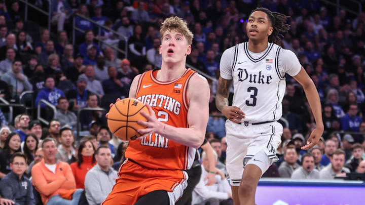 Feb 22, 2025; New York, NY, USA; Illinois Fighting Illini guard Kasparas Jakucionis (32) drives past Duke Blue Devils guard Isaiah Evans (3) in the second half at Madison Square Garden. Mandatory Credit: Wendell Cruz-Imagn Images Feb 22, 2025; New York, NY, USA; Illinois Fighting Illini guard Kasparas Jakucionis (32) drives past Duke Blue Devils guard Isaiah Evans (3) in the second half at Madison Square Garden. Mandatory Credit: Wendell Cruz-Imagn Images