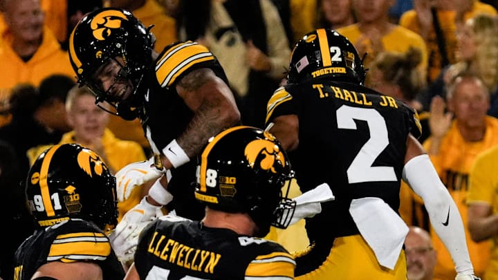 Iowa Hawkeyes defensive back Xavier Nwankpa (1) celebrates with Iowa Hawkeyes defensive back TJ Hall (2) after intercepting a pass during a college football game against the Penn State Nittany Lions Oct. 18, 2025 at Kinnick Stadium in Iowa City, Iowa.