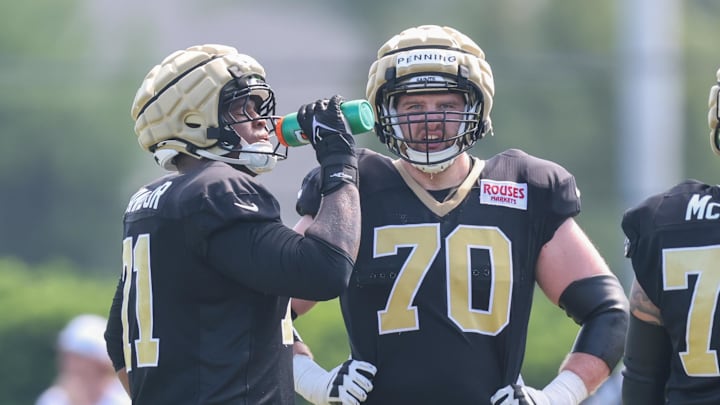 Jul 28, 2025; Metairie, LA, USA;  New Orleans Saints offensive tackle Trevor Penning (70) looks on at Ochsner Sports Performance Center. Mandatory Credit: Stephen Lew-Imagn Images