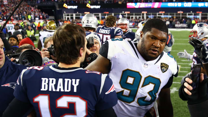 Jan 21, 2018; Foxborough, MA, USA; New England Patriots quarterback Tom Brady (12) greets Jacksonville Jaguars defensive end Calais Campbell (93) following the AFC Championship at Gillette Stadium. Mandatory Credit: Mark J. Rebilas-USA TODAY Sports