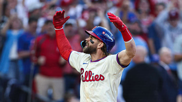 Philadelphia Phillies first baseman Harper reacts after hitting a home run against the New York Mets during game two of the NLDS for the 2024 MLB Playoffs at Citizens Bank Park. 