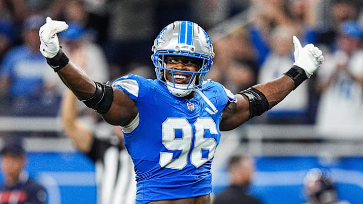 Detroit Lions linebacker Al-Quadin Muhammad (96) celebrates a tackle against Chicago Bears during the second half at Ford Field in Detroit on Sunday, Sept. 14, 2025.