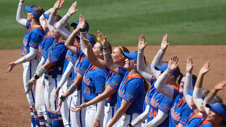 The Gator softball team gator chomps with with the Fans after their 10-2 win over Texas Tech in game 2 of the super regional of the NCAA Division 1 softball championship at Katie Seashole Pressly Stadium in Gainesville, FL on Saturday, May 23, 2026. [Alan Youngblood/Gainesville Sun]