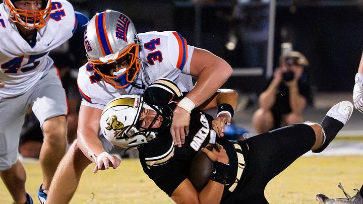 Bolles Bulldogs defensive lineman Asher Ghioto (34) tackles Oakleaf Knights Kashawn Murphy (90) in the second quarter Friday September 19, 2025 at Oakleaf High School in Oakleaf Plantation, Florida. The Bolles Bulldogs are 3-1 while the Oakleaf Knights are 4-0. Bolles lead 21-6 at the half. [Doug Engle/Florida Times-Union]