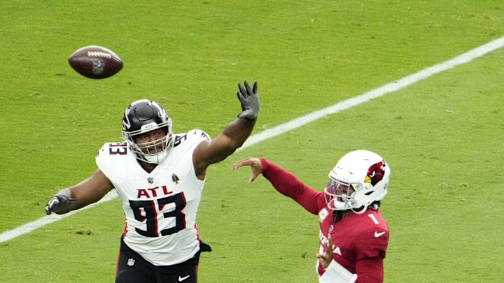 Arizona Cardinals quarterback Kyler Murray (1) throws a pass with pressure from Atlanta Falcons defensive tackle Calais Campbell (93) during his 2023 debut at State Farm Stadium on Nov. 12, 2023, in Glendale.