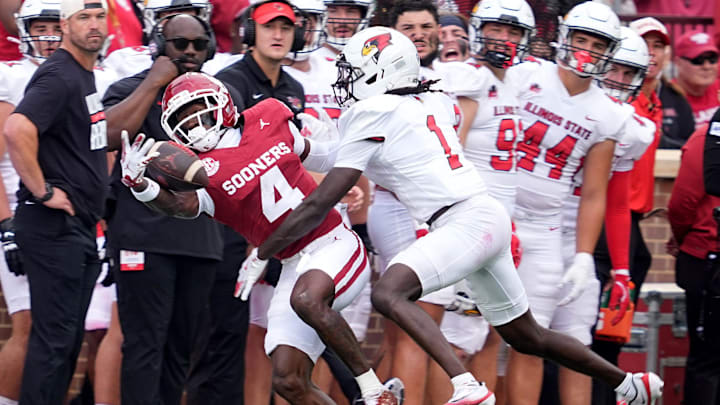 Oklahoma's Deion Burks (4) makes a reception as Shadwel Nkuba II (1) defends in the first half of the college football game between the University of Oklahoma Sooners and the Illinois State Redbirds at the Gaylord Family Oklahoma Memorial Stadium in Norman, Okla., Saturday, Aug. 30, 2025.
