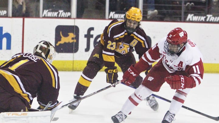 Wisconsin's Jack Gorniak (11) tries to get a shot past Minnesota goalie Justen Close (1) during the team's hockey game at the Kohl Center in Madison, Wis. on Saturday Feb. 11, 2023. Wisconsin won, 3-1.

Uw Minnesota Hockey 1 Feb 11 2023
