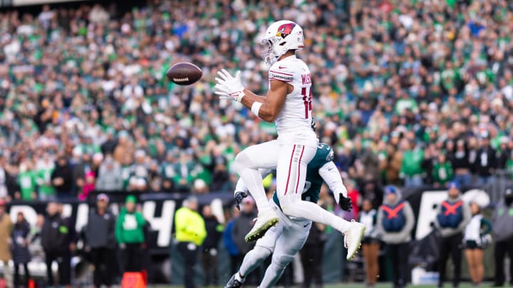 Dec 31, 2023; Philadelphia, Pennsylvania, USA; Arizona Cardinals wide receiver Michael Wilson (14) catches a touchdown past Philadelphia Eagles cornerback Kelee Ringo (22) at Lincoln Financial Field. Mandatory Credit: Bill Streicher-USA TODAY Sports Dec 31, 2023; Philadelphia, Pennsylvania, USA; Arizona Cardinals wide receiver Michael Wilson (14) catches a touchdown past Philadelphia Eagles cornerback Kelee Ringo (22) at Lincoln Financial Field. Mandatory Credit: Bill Streicher-USA TODAY Sports