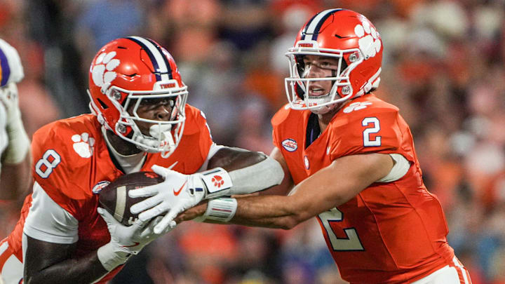Clemson running back Adam Randall (8) takes the handoff from quarterback Cade Klubnik (2) playing LSU during the first quarter at Memorial Stadium in Clemson, S.C. Saturday, August 30, 2025.