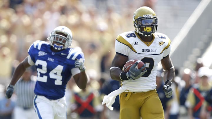 October 4, 2008;  Atlanta, GA, USA;  Georgia Tech Yellow Jacket wide receiver Demaryius Thomas (8) runs away from Duke Blue Devils safety Glenn Williams (24) to score a touchdown after catching a pass in the second half at Bobby Dodd Stadium. Georgia Tech defeated Duke 27-0. Mandatory Credit: Dale Zanine- Imagn Images