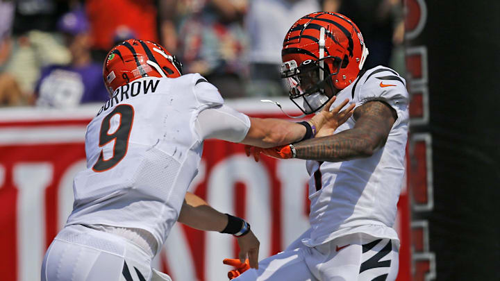 Cincinnati Bengals quarterback Joe Burrow (9) celebrates with wide receiver Ja'Marr Chase (1) after they connect for Chase's career-first touchdown in the second quarter of the NFL Week One game between the Cincinnati Bengals and the Minnesota Vikings at Paul Brown Stadium in downtown Cincinnati on Sunday, Sept. 12, 2021. The Bengals led 14-7 at halftime.