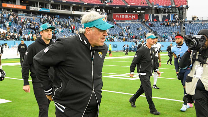 Dec 8, 2024; Nashville, Tennessee, USA;  Jacksonville Jaguars head coach Doug Pederson walks over to meet Tennessee Titans head coach Brian Callahan during the second half at Nissan Stadium. Mandatory Credit: Steve Roberts-Imagn Images