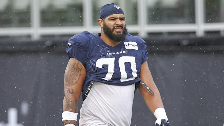 Jul 27, 2024; Houston, TX, USA; Houston Texans center Juice Scruggs (70) walks on the field at Houston Methodist Training Center. Mandatory Credit: Troy Taormina-Imagn Images