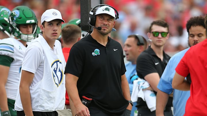 Sep 20, 2025; Oxford, Mississippi, USA; Tulane Green Wave head coach Jon Sumrall looks on during the second quarter against the Mississippi Rebels at Vaught-Hemingway Stadium. Mandatory Credit: Petre Thomas-Imagn Images Sep 20, 2025; Oxford, Mississippi, USA; Tulane Green Wave head coach Jon Sumrall looks on during the second quarter against the Mississippi Rebels at Vaught-Hemingway Stadium. Mandatory Credit: Petre Thomas-Imagn Images
