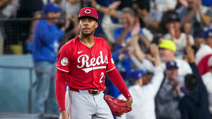 Cincinnati Reds starting pitcher Hunter Greene (21) reacts as Los Angeles Dodgers right fielder Teoscar Hernandez (37) runs the bases on a three-run home run in the third inning of the MLB National League Wild Card Game 1 between the Los Angeles Dodgers and the Cincinnati Reds at Dodger Stadium in Los Angeles on Tuesday, Sept. 30, 2025. The Dodgers won game 1 of the series, 10-5.