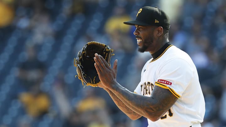 Sep 15, 2024; Pittsburgh, Pennsylvania, USA;  Pittsburgh Pirates relief pitcher Aroldis Chapman (45) reacts after the final out against the Kansas City Royals at PNC Park. Mandatory Credit: Charles LeClaire-Imagn Images