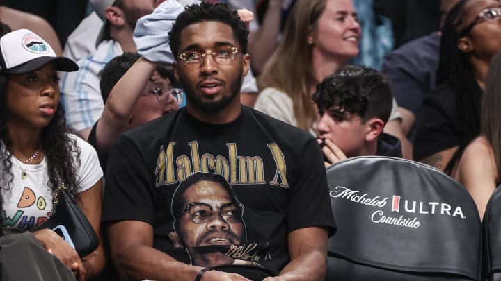 May 23, 2024; Brooklyn, New York, USA;  Cleveland Cavaliers guard Donovan Mitchell watches a game between the Chicago Sky and the New York Liberty in the second quarter at Barclays Center.