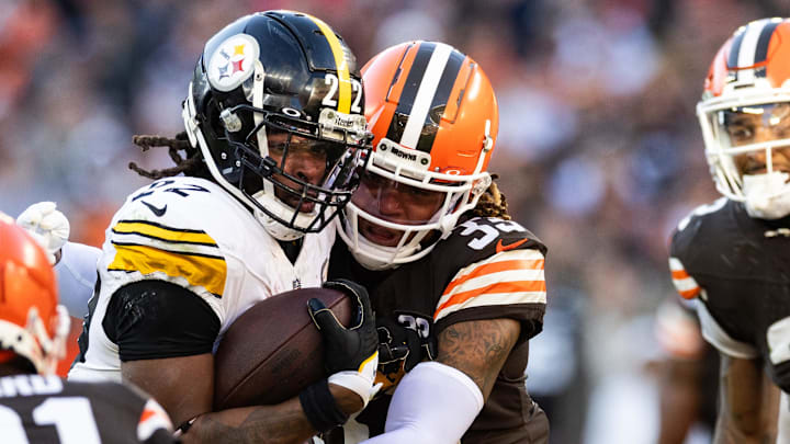 Nov 19, 2023; Cleveland, Ohio, USA; Cleveland Browns safety Ronnie Hickman (33) tackles Pittsburgh Steelers running back Najee Harris (22) during the fourth quarter at Cleveland Browns Stadium. Mandatory Credit: Scott Galvin-Imagn Images