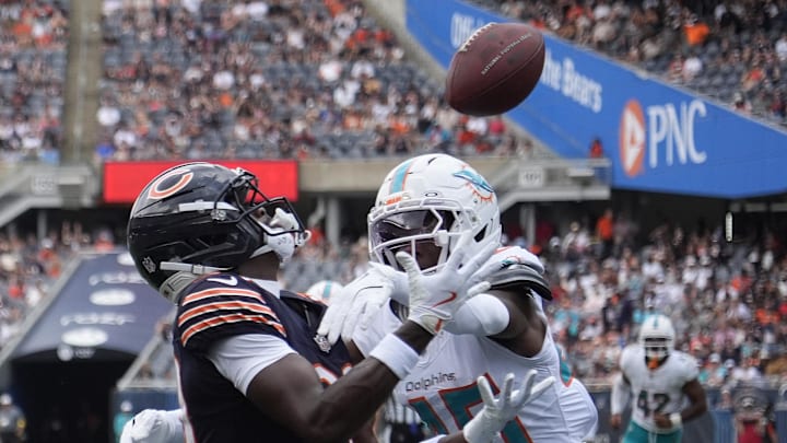 Aug 10, 2025; Chicago, Illinois, USA; Chicago Bears wide receiver Jahdae Walker (20) catches a touchdown pass as Miami Dolphins linebacker Jaelan Phillips (15) defends him during the second half at Soldier Field. Mandatory Credit: David Banks-Imagn Images