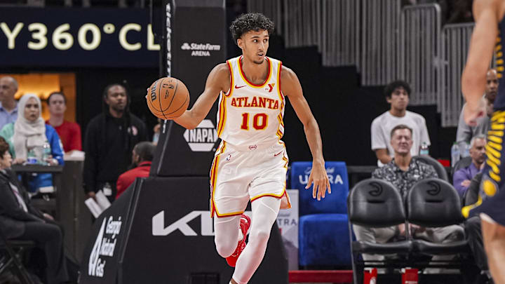 Oct 8, 2024; Atlanta, Georgia, USA; Atlanta Hawks forward Zaccharie Risacher (10) handles the ball against the Indiana Pacers during the first half at State Farm Arena. Mandatory Credit: Dale Zanine-Imagn Images