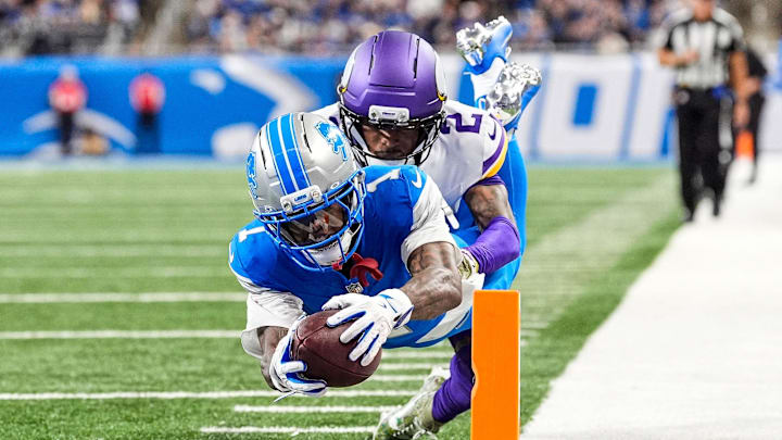 Detroit Lions wide receiver Jameson Williams (1) dives for a touchdown against Minnesota Vikings cornerback Isaiah Rodgers (2) during the second half at Ford Field in Detroit on Sunday, November 2, 2025. Detroit Lions wide receiver Jameson Williams (1) dives for a touchdown against Minnesota Vikings cornerback Isaiah Rodgers (2) during the second half at Ford Field in Detroit on Sunday, November 2, 2025.