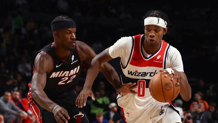[US, Mexico & Canada customers only] Nov 2, 2024; Mexico City, MEXICO; Washington Wizards player Bilal Coulibaly in action with Miami Heat player Jimmy Butler  during a NBA basketball game at Arena CDMX. Mandatory Credit: Henry Romero/Reuters via Imagn Images