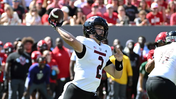 Sep 28, 2024; Raleigh, North Carolina, USA; Northern Illinois Huskies quarter back Ethan Hampton (2) throws a pass against the North Carolina State Wolfpack during second quarter at Carter-Finley Stadium. Mandatory Credit: Zachary Taft-Imagn Images