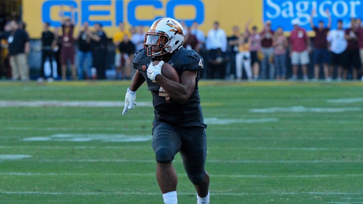 Nov 8, 2014; Tempe, AZ, USA; Arizona State Sun Devils running back Demario Richard (4) carries the ball during the second half against the Notre Dame Fighting Irish at Sun Devil Stadium. Mandatory Credit: Matt Kartozian-Imagn Images