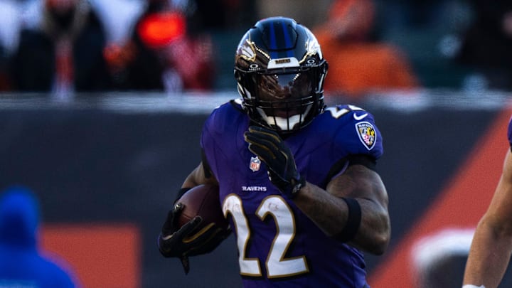 Baltimore Ravens running back Derrick Henry (22) runs the ball in the third quarter of the NFL football game between Baltimore Ravens and Cincinnati Bengals at Paycor Stadium in Cincinnati on Dec. 14, 2025.
