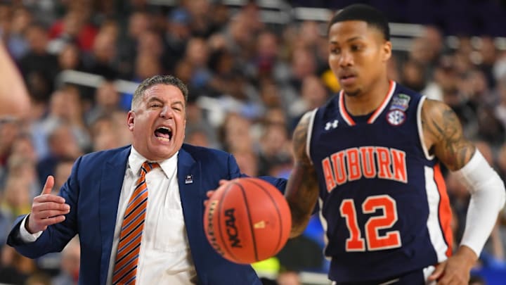 Auburn Tigers head coach Bruce Pearl yells from the sideline to guard J'Von McCormick (12)