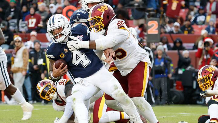 Dec 25, 2025; Landover, Maryland, USA; Dallas Cowboys quarterback Dak Prescott (4) is sacked by Washington Commanders defensive tackle Jer'Zhan Newton (95) during the second half at Northwest Stadium. Mandatory Credit: Geoff Burke-Imagn Images Dec 25, 2025; Landover, Maryland, USA; Dallas Cowboys quarterback Dak Prescott (4) is sacked by Washington Commanders defensive tackle Jer'Zhan Newton (95) during the second half at Northwest Stadium. Mandatory Credit: Geoff Burke-Imagn Images
