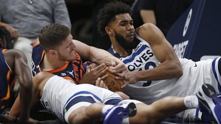 Nov 7, 2022; Minneapolis, Minnesota, USA; New York Knicks center Isaiah Hartenstein (55) battles with Minnesota Timberwolves center Karl-Anthony Towns (32) for a loose ball in the fourth quarter at Target Center. Mandatory Credit: Bruce Kluckhohn-Imagn Images Nov 7, 2022; Minneapolis, Minnesota, USA; New York Knicks center Isaiah Hartenstein (55) battles with Minnesota Timberwolves center Karl-Anthony Towns (32) for a loose ball in the fourth quarter at Target Center. Mandatory Credit: Bruce Kluckhohn-Imagn Images