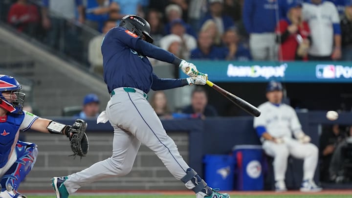 Oct 20, 2025; Toronto, Ontario, CAN; Seattle Mariners second baseman Jorge Polanco (7) singles in the third inning against the Toronto Blue Jays during game seven of the ALCS round for the 2025 MLB playoffs at Rogers Centre. Mandatory Credit: Nick Turchiaro-Imagn Images