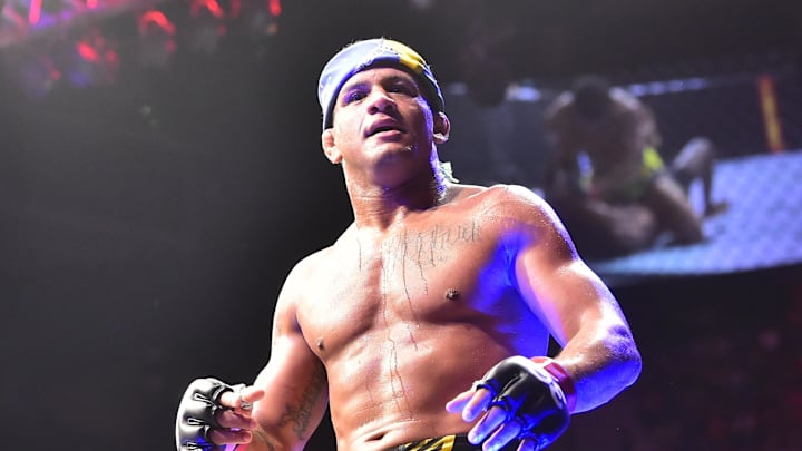 Jan 21, 2023; Rio de Janeiro, Brazil; Gilbert Burns (red gloves) reacts after the fight against Neil Magny (blue gloves) during UFC 283 at Jeunesse Arena. Mandatory Credit: Jason da Silva-Imagn Images