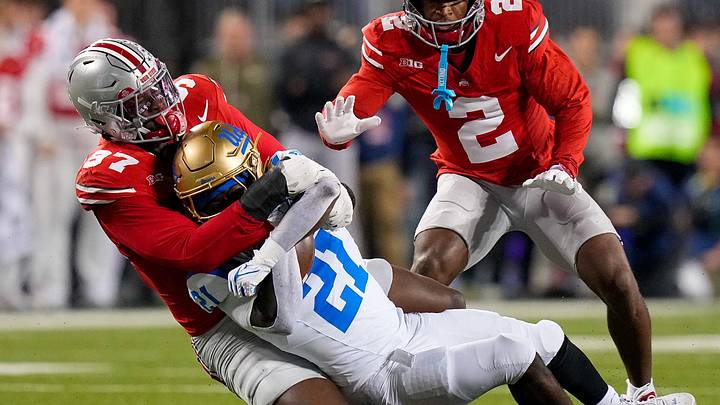 Ohio State Buckeyes defensive end Kenyatta Jackson Jr. (97) tackles UCLA Bruins running back Jaivian Thomas (21) in the first half of the NCAA college football game at Ohio Stadium on Saturday, Nov. 15, 2025 in Columbus, Ohio. Ohio State Buckeyes defensive end Kenyatta Jackson Jr. (97) tackles UCLA Bruins running back Jaivian Thomas (21) in the first half of the NCAA college football game at Ohio Stadium on Saturday, Nov. 15, 2025 in Columbus, Ohio.