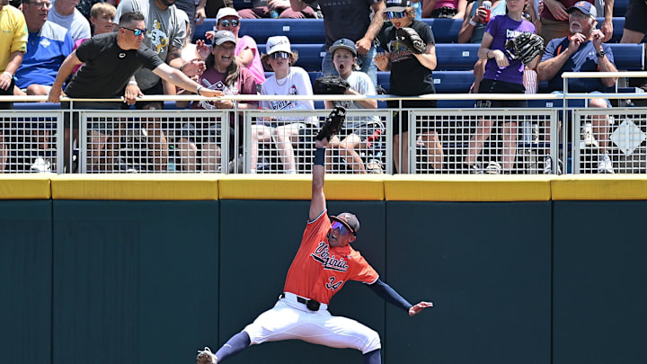 Jun 16, 2024; Omaha, NE, USA;  Fans react to a catch by Virginia Cavaliers center fielder Harrison Didawick (34) against the Florida State Seminoles during the second inning at Charles Schwab Field Omaha. Mandatory Credit: Steven Branscombe-Imagn Images