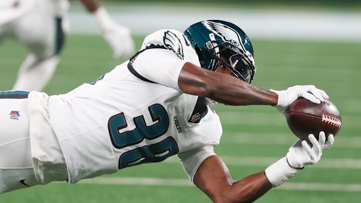 Aug 22, 2025; East Rutherford, New Jersey, USA; Philadelphia Eagles safety Lewis Cine (38) intercepts a pass during the second half against the New York Jets at MetLife Stadium. Mandatory Credit: Vincent Carchietta-Imagn Images