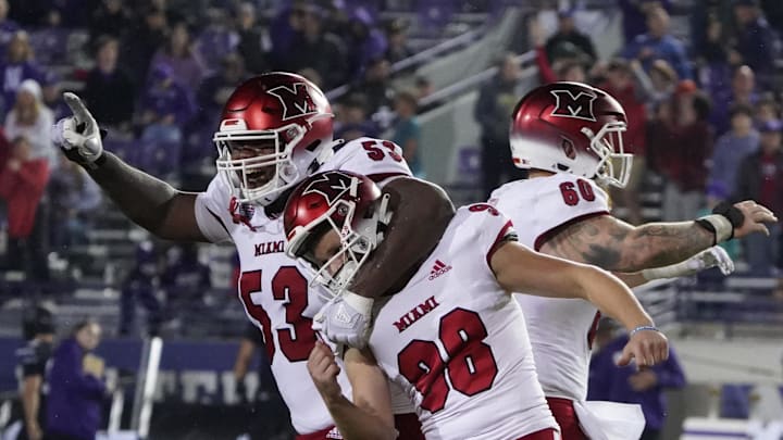 Sep 24, 2022; Evanston, Illinois, USA; Miami (Ohio) Redhawks place kicker Graham Nicholson (98) celebrates the game winning field goal with offensive lineman Caleb Shaffer (53) against the Northwestern Wildcats during the second half at Ryan Field. Mandatory Credit: David Banks-Imagn Images