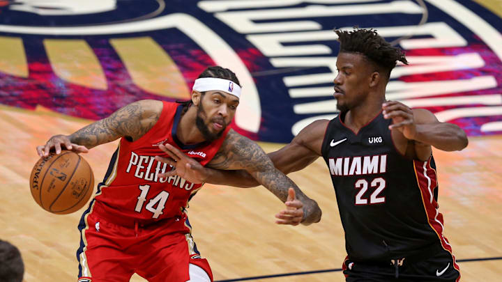 Mar 4, 2021; New Orleans, Louisiana, USA; New Orleans Pelicans forward Brandon Ingram (14) is defended by Miami Heat forward Jimmy Butler (22) in the fourth quarter at the Smoothie King Center. Mandatory Credit: Chuck Cook-Imagn Images