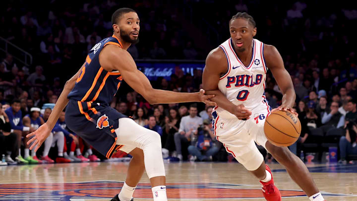 Philadelphia 76ers guard Maxey drives to the basket against New York Knicks forward Bridges during the third quarter at Madison Square Garden. Philadelphia 76ers guard Maxey drives to the basket against New York Knicks forward Bridges during the third quarter at Madison Square Garden.