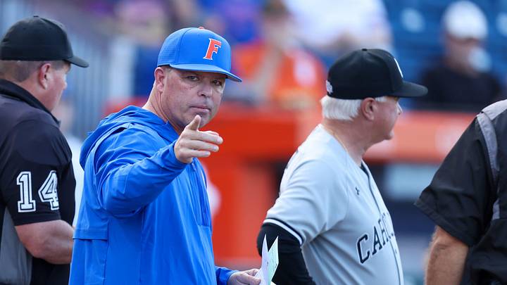 Florida head coach Kevin O'Sullivan meets with South Carolina head coach Paul Mainieri before an NCAA baseball game at Condron Ballpark in Gainesville, FL on Friday, March 13, 2026. [Alan Youngblood/Gainesville Sun]