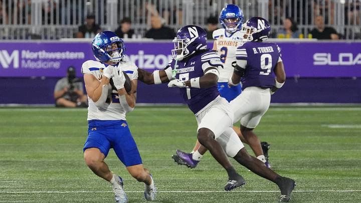 Sep 5, 2026; Evanston, Illinois, USA; South Dakota State Jackrabbits wide receiver Grahm Goering (12) catches a pass against Northwestern Wildcats defensive back Ore Adeyi (7) during the second half at Northwestern Medicine Field at Martin Stadium. Mandatory Credit: David Banks-Imagn Images Sep 5, 2026; Evanston, Illinois, USA; South Dakota State Jackrabbits wide receiver Grahm Goering (12) catches a pass against Northwestern Wildcats defensive back Ore Adeyi (7) during the second half at Northwestern Medicine Field at Martin Stadium. Mandatory Credit: David Banks-Imagn Images