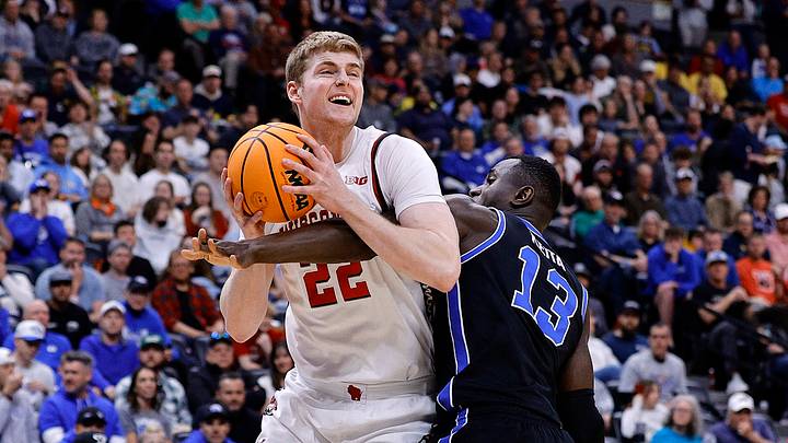 Mar 22, 2025; Denver, CO, USA; Wisconsin Badgers forward Steven Crowl (22) attempts to shoot the ball against Brigham Young Cougars center Keba Keita (13) during the first half in the second round of the NCAA Tournament  at Ball Arena. Mandatory Credit: Isaiah J. Downing-Imagn Images