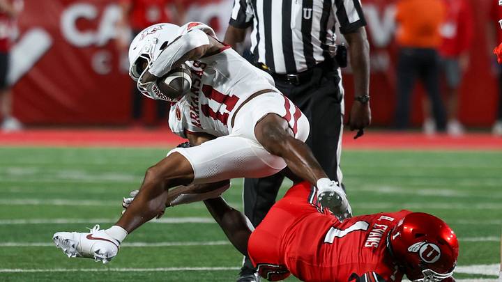 Sep 12, 2026; Salt Lake City, Utah, USA; Arkansas Razorbacks wide receiver Monte Harrison (11) is tripped up by Utah Utes safety Rabbit Evans (1) during the first quarter at Rice-Eccles Stadium. Mandatory Credit: Rob Gray-Imagn Images Sep 12, 2026; Salt Lake City, Utah, USA; Arkansas Razorbacks wide receiver Monte Harrison (11) is tripped up by Utah Utes safety Rabbit Evans (1) during the first quarter at Rice-Eccles Stadium. Mandatory Credit: Rob Gray-Imagn Images